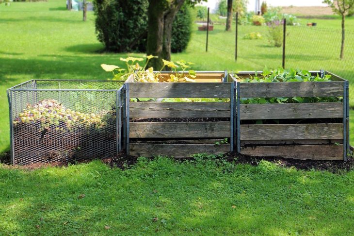 3 wooden compost bins ouside